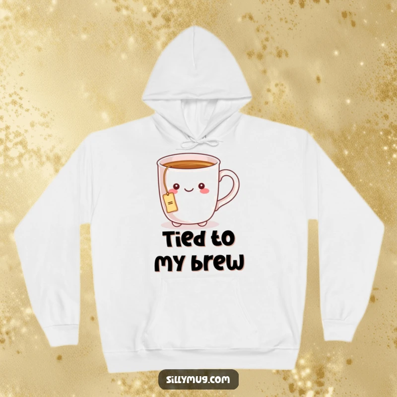 Funny hoodie showing a kawaii mug character with a tea bag string around its handle, offering comfort and tea-time charm.
